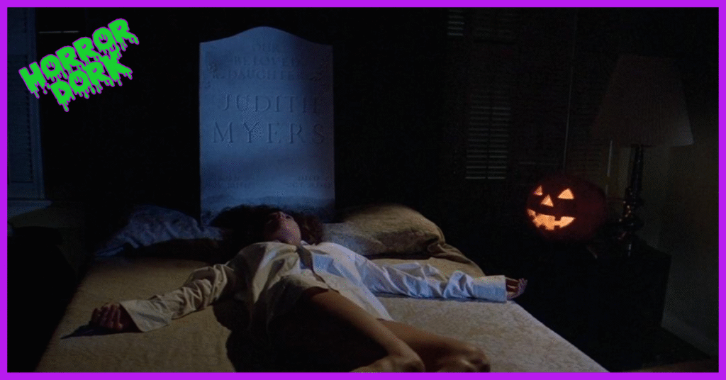 Linda’s body arranged under Judith Myers’ gravestone in Halloween (1978), symbolizing Michael Myers’ ritual recreation of his first murder.