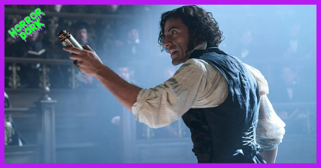 Actor portraying Victor Frankenstein in Guillermo del Toro’s Netflix adaptation, holding a vial in a dimly lit lecture hall, featured on Horror Dork.